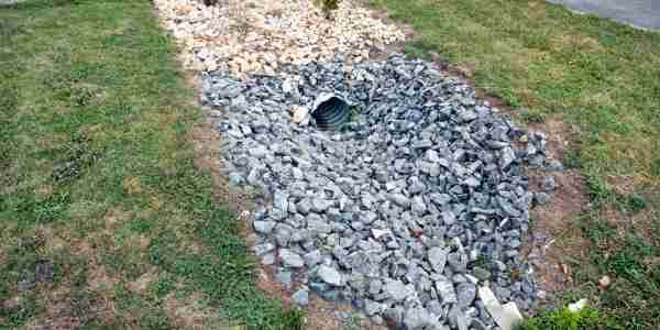 drainage solution with a pipe and rocks