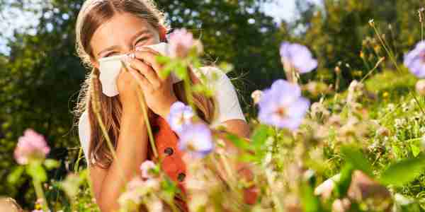 girl with allergies in a garden